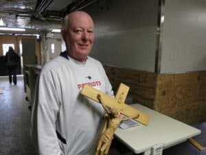 Mike White, a material management consultant on the decommissioning of the old St. Joseph Hospital, holds one of the more that 450 crosses being donated.